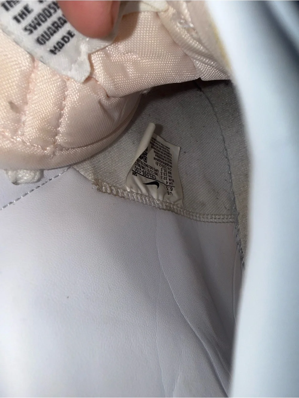 Nike White High-Top Sneakers with Black Swoosh